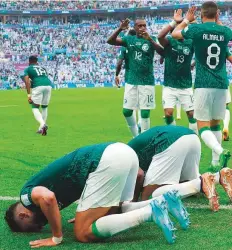  ?? AFP ?? Saudi Arabia forward Saleh Al Shehri (left) celebrates after scoring his team’s first goal against Argentina.
