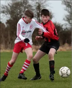  ??  ?? Tom Wheatley (Gorey Rangers) battling with Ryan Carroll.