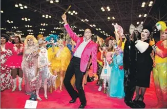  ?? The Macfarlane­s ?? RuPAUL cuts the ribbon at DragCon New York 2018. The L.A. convention is set for next weekend.