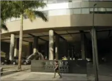  ?? ARNULFO FRANCO - THE ASSOCIATED PRESS ?? A woman past walks past the main entrance to the Trump Ocean Club Internatio­nal Hotel and Tower in Panama City, Friday. One of President Donald Trump’s family businesses is battling an effort to physically evict its team of executives from a luxury...