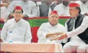  ?? PTI ?? (From left) Samajwadi Party leader Ramgopal Yadav, party patriarch Mulayam Singh Yadav and SP chief Akhilesh Yadav at a rally in Delhi on Saturday.