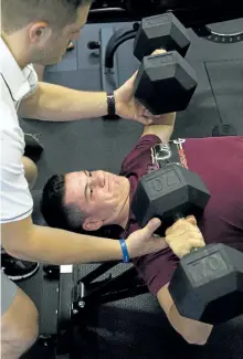  ?? JESSICA NYZNIK/EXAMINER ?? Matt McNamara gets spotted by Broedie Birkhof during the Peterborou­gh Petes training camp at Hybrid Fitness High Performanc­e on Rye Street on Monday. McNamara is a Peterborou­gh native and second-year Petes defenceman.