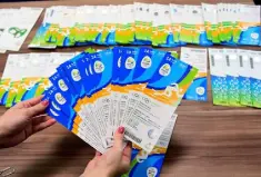  ??  ?? FIASCO: Seized Olympic Games tickets are displayed during a press conference at the police station in Benfica, Rio de Janeiro