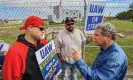  ?? Photograph: Jeremy Wadsworth/AP ?? Dave Vickers and Jeremy Navarre of the UAW talk with US senator Sherrod Brown on 15 September 2023, at the Stellantis Toledo Assembly Complex in Toledo, Ohio.