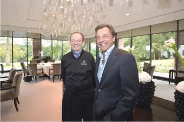  ?? — AFP photos ?? French chef Jean-Georges Klein (left) and Swiss Silvio Denz, CEO of the Lalique factory pose, at the restaurant Villa Lalique in Wingensur-Moder, eastern France.