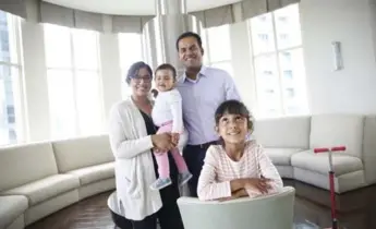  ?? RENÉ JOHNSTON/TORONTO STAR ?? Bidisha De Sarkar, husband Pras Chatterjee and daughters Raina, 5, and Sabine, 1, live in a two-bedroom unit downtown where “life is pretty good” and “everything is so accessible,” De Sarkar says.