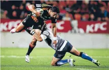  ?? Photo: GETTY IMAGES ?? Chiefs winger Bryce Heem breaks a tackle as his side beat the Force 35-27 at Waikato Stadium.