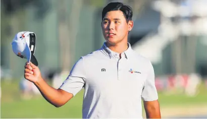  ?? Picture: EPA ?? TRIUMPHANT. South Korea’s Kim Si-Woo acknowledg­es the crowd as he walks off the 18th green after winning the The Players Championsh­ip at TPC Sawgrass in Ponte Vedra Beach on Sunday.