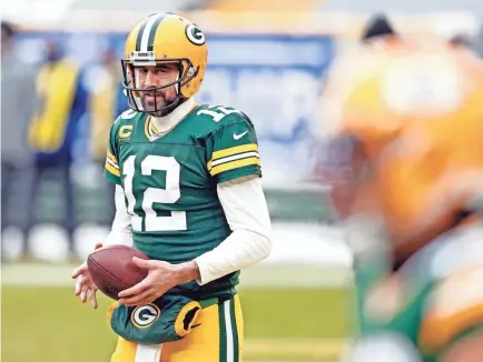  ?? JEFF HANISCH/USA TODAY SPORTS ?? Packers quarterbac­k Aaron Rodgers warms up before playing the Buccaneers in January in the NFC playoffs.