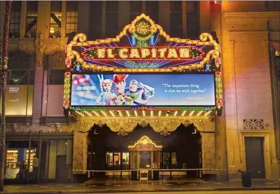  ?? Jay L. Clendenin Los Angeles Times ?? MOVIE THEATERS, which employed about 150,000 in the U.S., shut down and have struggled to stay af loat. Above, a deserted El Capitan on Hollywood Boulevard.