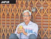  ?? HIMANSHU VYAS /HT ?? A shopkeeper outside his shop in Jaipur on Monday.