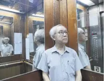  ?? PHOTO: REUTERS ?? Who’s there? . . . Landlord Ng Goonlau poses in a lift of a building of his in Hong Kong where two suicides have taken place.