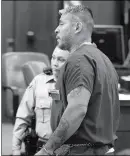  ?? Buy this photo at YumaSun.com PHOTO BY RANDY HOEFT/YUMA SUN ?? CARLOS LEAL (RIGHT) IS ESCORTED OUT of court Tuesday afternoon by a Yuma County Sheriff’s Office detention officer after appearing before Justice of the Peace Greg Stewart.