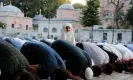  ?? Dilara Senkaya/Reuters ?? People pray outside the Hagia Sophia Grand Mosque in Istanbul. Photograph: