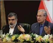  ?? Iranian Presidency Office ?? BEHROUZ KAMALVANDI, left, of Iran’s nuclear agency hinted at even higher uranium enrichment.