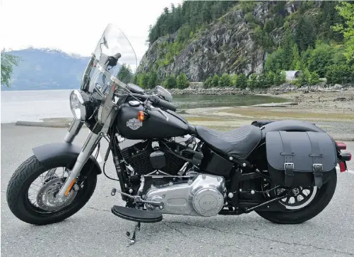  ?? Alexandra Straub/ Postmedia News ?? The Black Denim matte finish on the 2013 Harley-Davidson Softail Slim gives the bike’s stripped-down look an edgy flair.