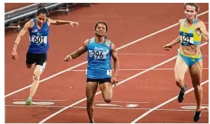  ?? — FAIHAN GHANI/ The Star ?? Good effort: Malaysia’s Zaidatul Husniah Zulkifli (left) finished eighth in the women’s 100m final in the Asian Games at the Gelora Bung Karno Main Stadium.