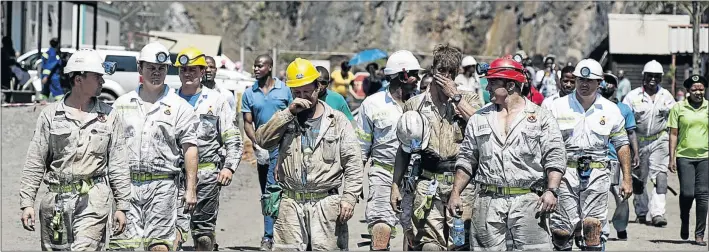 ?? PHOTO: IHSAAN HAFFEJEE ?? Rescue workers walk away from the mine after their mission to reach missing workers after the shaft collapse at the Lily Mine near Barberton failed.