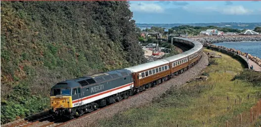  ?? ?? ABOVE: Intercity liveried 47828 hauls Statesman Railtour’s ‘Dartmouth Royal Regatta Statesman’ from High Wycombe to Kingswear on the Paignton & Dartmouth Steam Railway on August 28, passing Langstone Rock with 47614 on the rear of the train. Dean Parsons