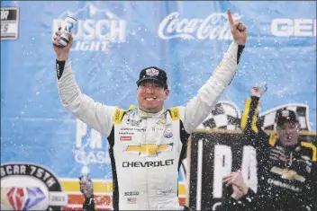  ?? JAE C. HONG/AP ?? KYLE BUSCH CELEBRATES Fontana, Calif., on Sunday. after winning a Cup Series auto race at Auto Club Speedway in