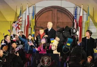  ?? Alastair Grant/Associated Press ?? President Joe Biden poses with children after meeting with Polish President Andrzej Duda in Warsaw, Poland, Tuesday.