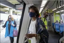  ?? KARL MONDON — STAFF ARCHIVES ?? Nuria Fernandez, then-general manager of the Valley Transporta­tion Authority, boards a train at the Berryessa BART station in North San Jose for a ride up to the Milpitas BART station in 2020.