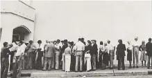  ?? Associated Press file photo ?? Hundreds of customers of the insolvent Penn Square Bank line up to withdraw their money, on July 6, 1982, in Oklahoma City. Modern technology might’ve sped up the fall of the Silicon Valley Bank.