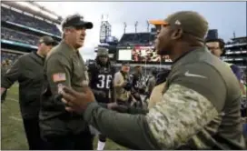  ?? MICHAEL PEREZ — THE ASSOCIATED PRESS ?? Eagles head coach Doug Pederson, left and Broncos head coach Vance Joseph meet after Sunday’s game in Philadelph­ia. The Eagles won, 51-23.