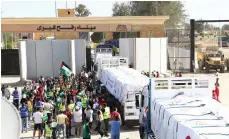  ?? EPA ?? Lorries carrying humanitari­an aid bound for the Gaza Strip cross the Rafah border gate