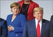  ?? DOUG MILLS / THE NEW YORK TIMES ?? President Donald Trump and German Chancellor Angela Merkel at the NATO summit in Brussels on Wednesday.