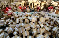  ?? AFP ?? Cross-border e-commerce is the booming backdoor avenue allowing Chinese consumers to buy overseas-made goods online and effectivel­y circumvent regulatory issues. —