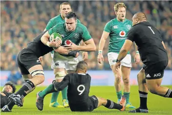  ?? Pictures: AFP/PAUL FAITH ?? STUNNING PERFORMANC­E: Ireland’s lock James Ryan, centre, is tackled by New Zealand eighthman Kieran Read, left, and scrumhalf Aaron Smith during the rugby Test match at the Aviva stadium in Dublin on Saturday