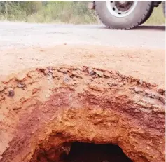  ??  ?? A section of the Boterekwa Road that caved in after illegal gold panners in the area dug a tunnel underneath