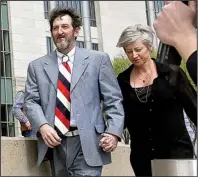  ?? Arkansas Democrat-Gazette/BENJAMIN KRAIN ?? Former Circuit Judge Michael Maggio and his wife, Dawn, leave the federal courthouse Thursday after his sentencing.