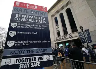  ?? Tribune News Service/getty Images ?? Fans line up in front of Yankee Stadium in New York on April 1. Schools, businesses and sports and entertainm­ent venues are considerin­g rapid COVID-19 tests as a requiremen­t for entry.