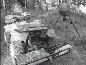  ?? Arkansas Democrat-Gazette/BRYAN HENDRICKS ?? A Haul Master ATV receiver hitch rack makes deer camp tasks easier. It is especially useful for hauling deer out of the woods.