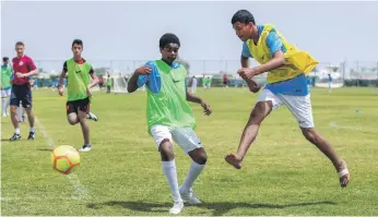  ?? Victor Besa / The National ?? At a Rising Stars camp for Al Mirfa boys, the young footballer­s took part in two weeks of sessions under coaches from Manchester City Football Schools