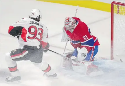  ?? DARIO AYALA/MONTREAL GAZETTE ?? Ottawa’s Mike Zibanejad looks on as Bobby Ryan’s shot gets by Montreal goalie Carey Price on Friday night.