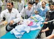  ?? SONU MEHTA/ HT ?? The 5-yr-old rape victim (covered with a sheet) is taken from the hospital, where she underwent a life-saving surgery.