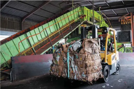  ?? Photo: Mpact Recycling ?? Before heading to a recycling mill, paper is sorted and baled into different grades such as K4, or old corrugated cardboard containers and paper grocery bags.