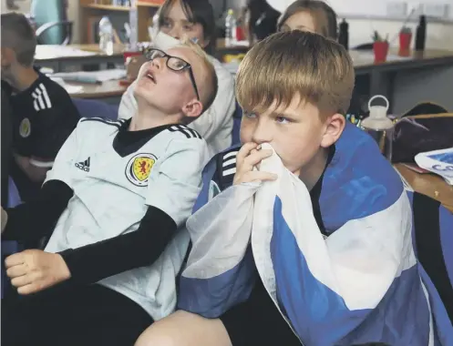  ??  ?? 0 P6 pupils at Denny Primary School in Falkirk watch the Scotland v Czech Republic game in the Euro 2020 Group stage