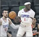  ?? DARREN ABATE — THE ASSOCIATED PRESS ?? The Clippers’ Reggie Jackson looks to pass during L.A.’s game against the Spurs on Thursday night. Jackson had a game-high 28 points in the Clippers’ victory.