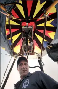  ??  ?? Rick Davis
Arkansas Democrat-Gazette /RYAN McGEENEY
of Harrison looks to his ground crew Saturday morning as he ascends into the air.