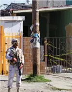  ?? ?? Start: A soldier keeps guard outside the warehouse where tunnel starts in Mexico