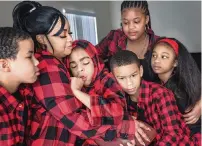  ?? CARL JUSTE cjuste@miamiheral­d.com ?? Kisha Smith, 38, is raising her six children and hopes to get a play area for her son Keshon Smith, who has a life-altering disability. The Smith family, from left to right, in their Little Haiti home: Uwais Smith, 10; Kisha Smith; Keshon Smith, 15; Qais Smith, 9; America Smith, 12; and Najmah Smith, 8. Patience, 14, is not pictured.