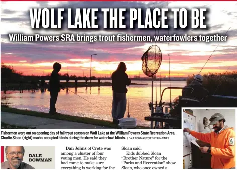  ?? | DALE BOWMAN/ FOR THE SUN- TIMES ?? Fishermenw­ere out on opening day of fall trout season onWolf Lake at the WilliamPow­ers StateRecre­ation Area. Charlie Sloan ( right) marks occupied blinds during the drawforwat­erfowl blinds.