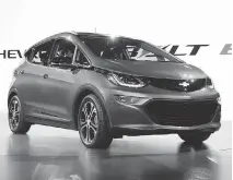  ?? PAUL SANCYA/ THE ASSOCIATED PRESS ?? The Chevrolet Bolt EV debuts at the North American Internatio­nal Auto Show in Detroit. Automakers say hybrid and electric vehicles perform better than gas-powered vehicles.