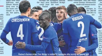  ??  ?? Chelsea's German striker Timo Werner is mobbed by teammates after scoring the opening goal