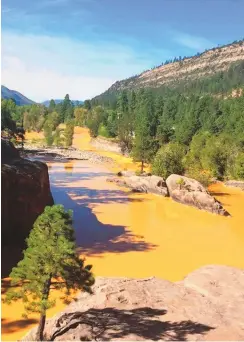  ?? FARMINGTON DAILY TIMES ?? This photo from a location above Silverton, Colorado, shows mine pollution released into the Animas River after the Gold King Mine spill in August of 2015. Some representa­tives of New Mexico’s acequias assert the proposed federal Mining Regulatory Clarity Act would give the mining industry indiscrimi­nate access to public lands to dump waste rock and toxic chemicals.