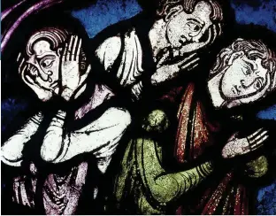  ??  ?? People are consumed by fear of the plague in a 14th-century window panel from Canterbury Cathedral. The Black Death is a looming threat in The Last Hours